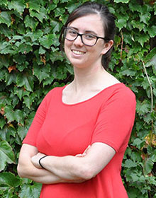 Natalia's headshot, wearing a red top.