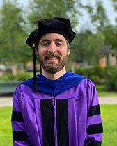 Max headshot wearing graduation cap and gown.jpg