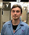 Casey's headshot, wearing a blue NU lab coat 