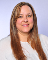 Alice's professional headshot wearing a grey collared shirt